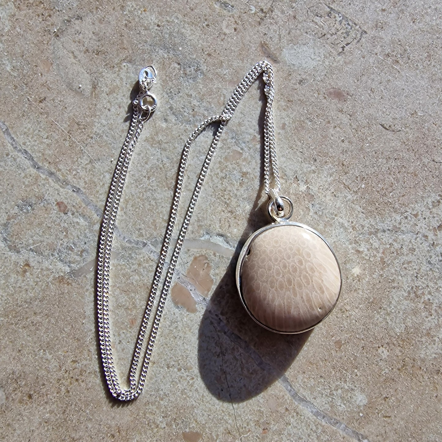 Josefin beach stone necklace with cut white coral stone